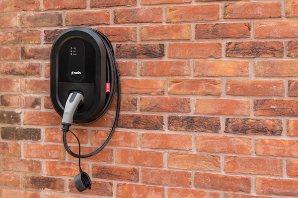 EV charger unit mounted on brick wall