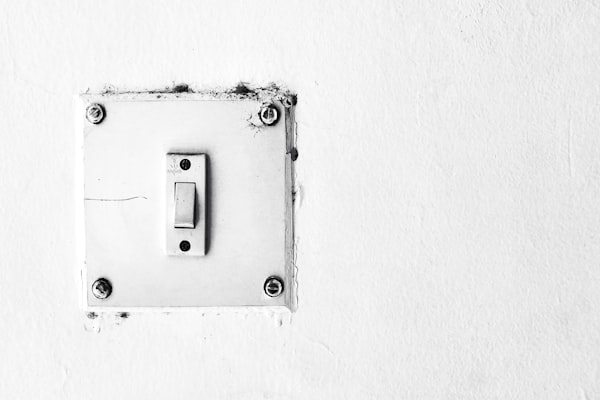 Clean white light switch on wall