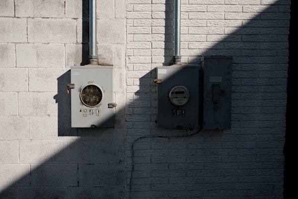 Electric meters and panel boxes on building wall