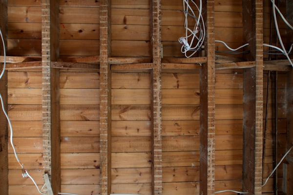 Exposed wall framing with residential electrical wiring